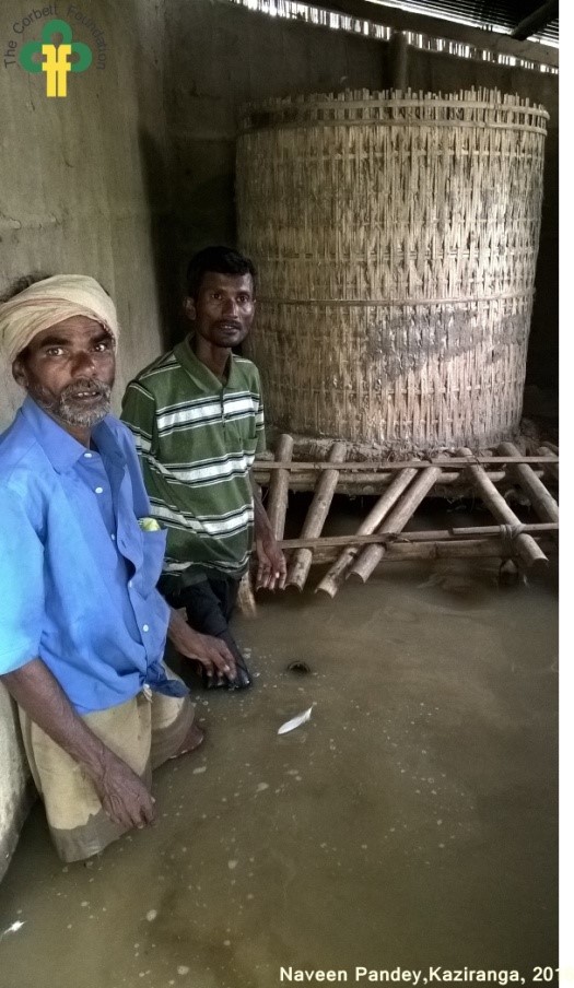 Image 9: TCF team helped this villager to protect the food grains from increasing flood waters.