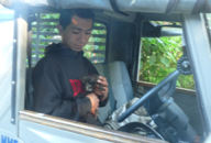 Subash holds a kitten which was handed through the window to him by an owner who did not want it.